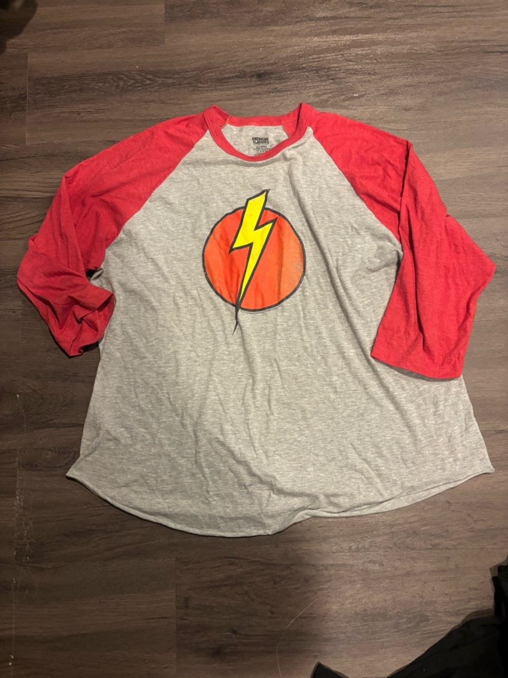 The Flash Men's Long-Sleeve Raglan Tee with Red Sleeves and Lightning Graphic